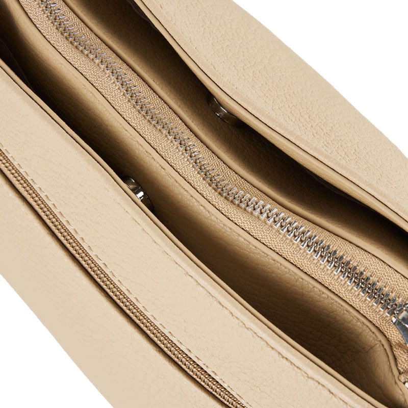 Classic white shoulder bag with reinforced stitching and practical compartments, tailored for private label manufacturing services.