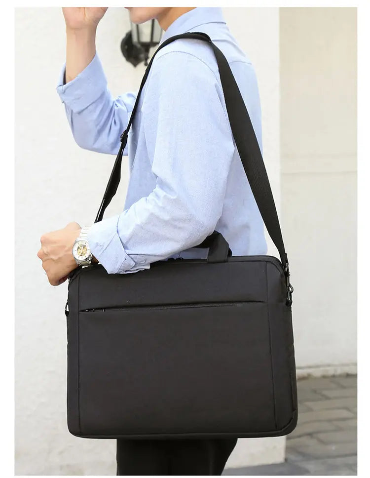Man carrying blue briefcase - side view showing slim profile