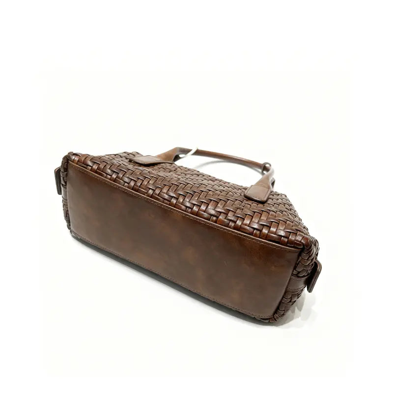 Woven handbag open top view showing polyester lining