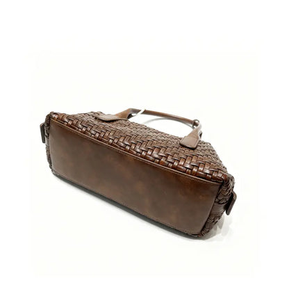 Woven handbag open top view showing polyester lining