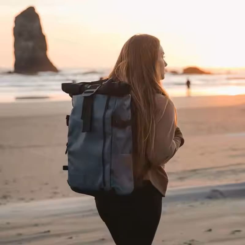 Custom photo backpack with expandable tripod pocket and padded organization compartments, designed for creative professionals.