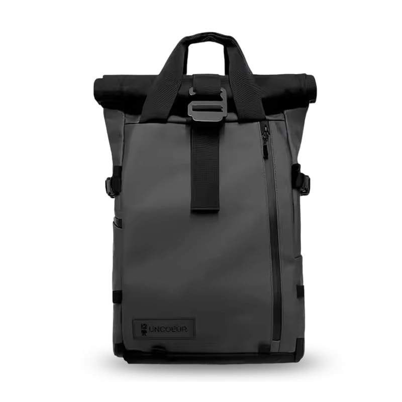 Weatherproof black camera backpack with built-in cube and laptop sleeve, co-developed by UNCOEUR and RANGE for OEM production.
