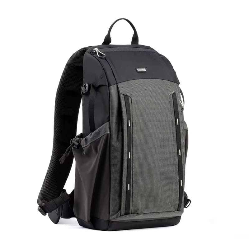Customizable black backpack for creatives, featuring multi-compartment layout and expandable water bottle or tripod pocket.