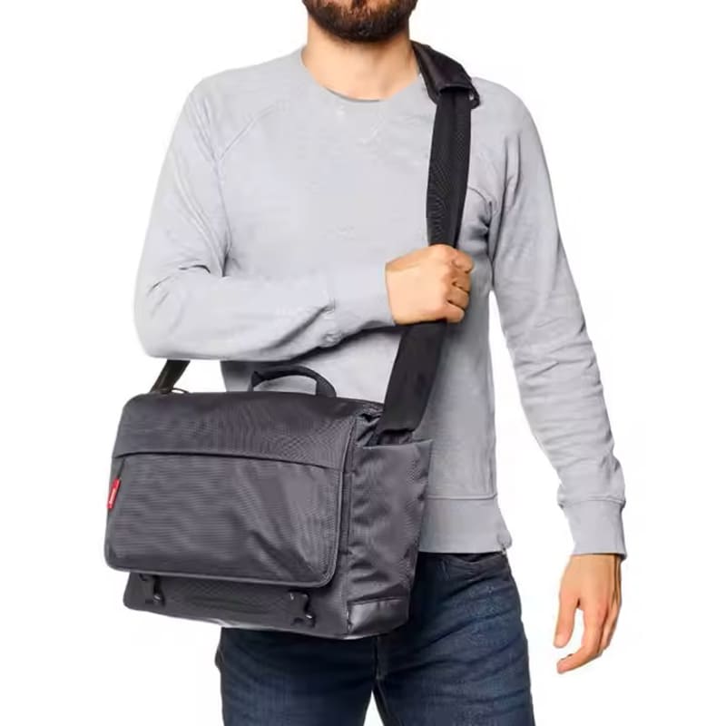 Professional camera and laptop bag featuring reinforced stitching and adjustable straps, suitable for everyday creatives