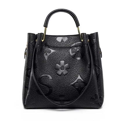 Floral embossed tote bag black front view top handle structured tote