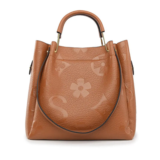 Floral embossed tote bag tan brown front view designer commuter tote